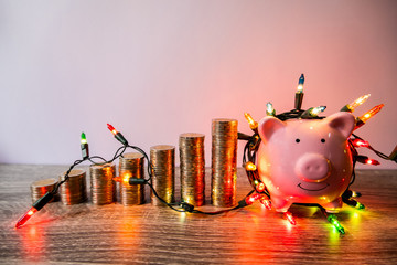 Pink piggy bank with party light, organize a party for the event where successful in saving money...