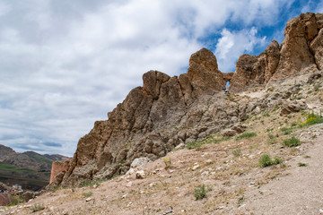 Fototapeta na wymiar Dogubayazıt, Turkey, Middle East: panoramic and breathtaking view of the footpath up to the rocks beside the ancient castle of Old Beyazit, near the Ishak Pasha Palace and Eski Bayezid Cami mosque
