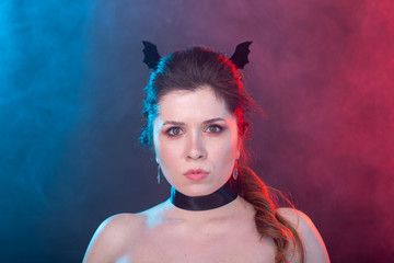 Halloween, holidays and carnival concept - vamp woman in gothic style.