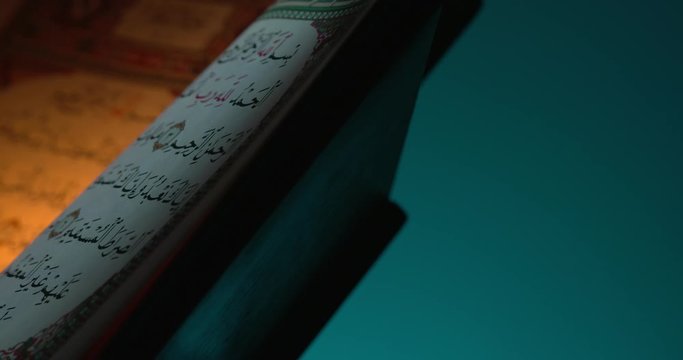 Holy Quran on Book Rest with Prayer Beads Close Up Rotation 11