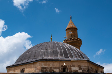 Dogubayazıt, Turkey: the minaret and the dome of the mosque Eski Bayezid Cami in the breathtaking valley of the famous Ishak Pasha Palace, located on the road up to the mountains near Iranian border