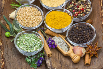 Variety of spices on wooden background