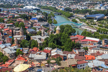 Aria view of Tbilisi skyline with River Kura and Bridge of Peace and other ancient and modern buildings and bridges © Susan Vineyard 
