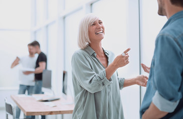 Fototapeta premium smiling businesswoman explaining something to her colleague