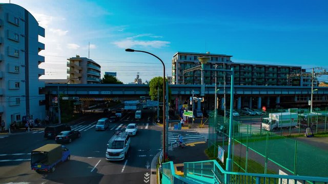 A timelapse of downtown street at Kanpachi avenue in Tokyo daytime wide shot panning