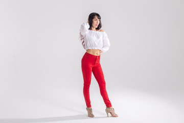Latin dance, bachata lady, jazz modern and vogue dance concept - Beautiful young woman dancing on...