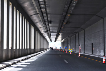 Road tunnel in mountains. Mountain road tunnel Tunnel on the highway.  Automobile trip. Pathway with tunnel. Drive through the mountain