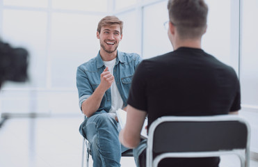 two young men talking in the TV Studio