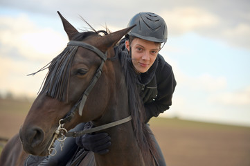 Teenage boy with a horse