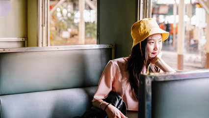 Beautiful young asian about 20-40 years old, white skin, black hair traveler excit with in train station.