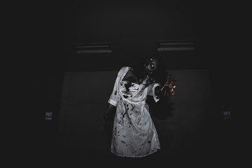 Portrait of asian woman make up ghost face with blood,Horror scene,Scary background,Halloween...
