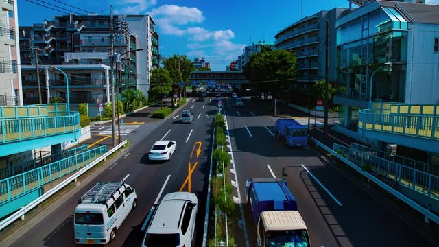 A timelapse of downtown street at Kanpachi avenue in Tokyo daytime wide shot panning