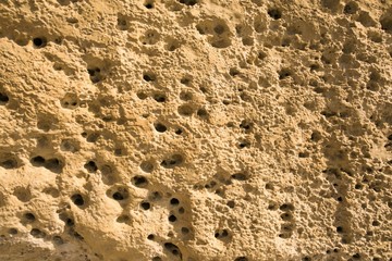 Valletta, Malta, August 2019. The structure of the porous Maltese stone as an original background.