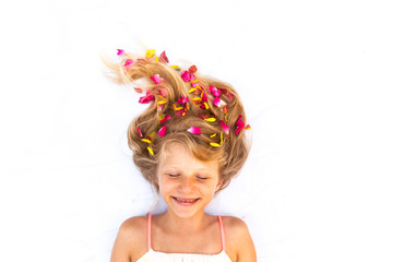 lovely smiling young child with floral adornment hairdo copy space closed eyes