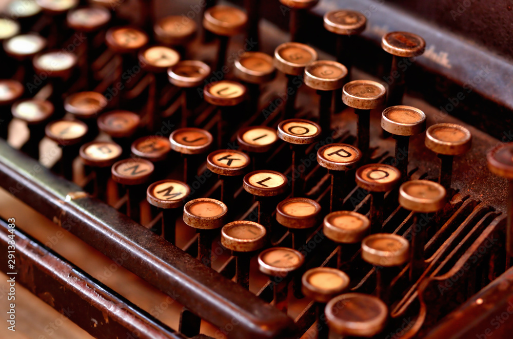 Fototapete detail of very old antique typewriter keyboard. low depth of field.