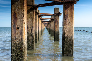 Shoeburyness anti submarine ww11 barrier going out to sea with rusted fittings