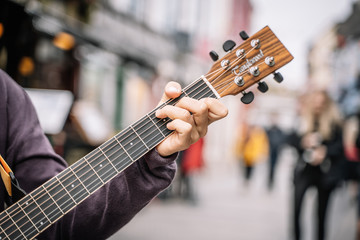Close Up Of A Guitarist Playing On The Street