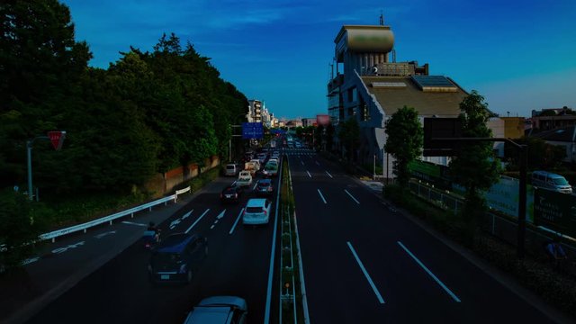A timelapse of downtown street at Kanpachi avenue in Tokyo daytime wide shot panning