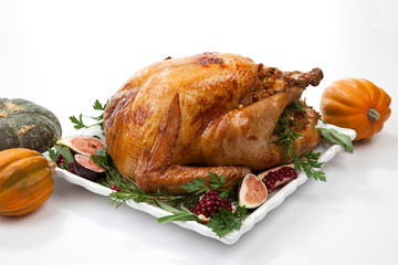 Traditional Roasted Turkey on White With Pumpkin
