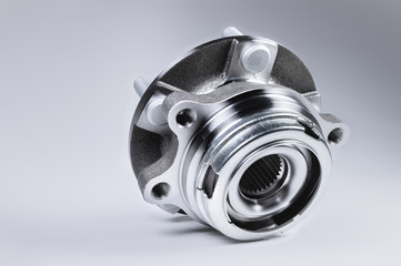 New Wheel hub assembly with bearing. This is part of the car suspension on a gray background with a...