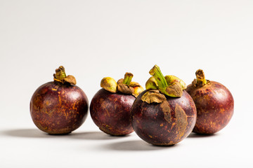 Group of mangosteen fruits on white background