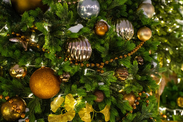 Decorated Christmas tree close up details. Christmas tree lights and toys
