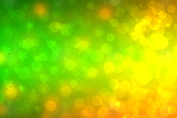 Abstract autumn gradient gold yellow green bright background texture with leaves and bokeh circles. Indian summer. Card design with space. Beautiful backdrop.