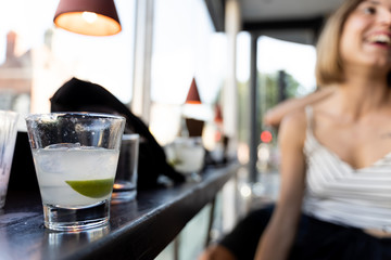beautiful woman having a margarita cocktail in a glass