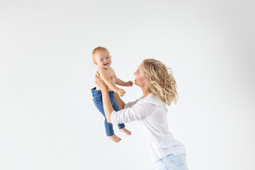 Childhood, motherhood and family concept - Portrait happy mother holds her baby