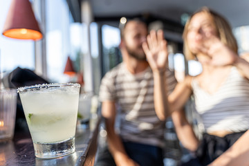 People enjoying the happy hour at the bar.