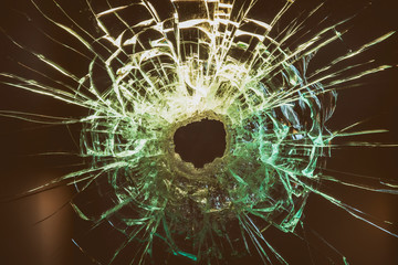 Bullet Hole On A Glass Surface