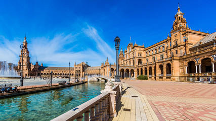 Fototapeta premium Plaza de Espana in Seville Spain with its imposing building, river and fountain on a beautiful sunny day