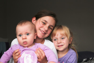 Close up Portrait of Three Beautiful Sisters, One Cute Toddler Girl , 6 Month Old Baby Girl, 7 Years Old Girl, Best Friends Forever, Happy  family concept, The most Beautiful Girls, Princesses 