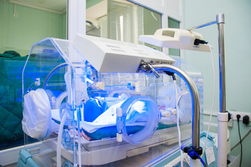 New born baby sleep in incubator