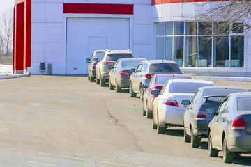 cars line up at the car wash station
