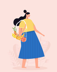 Girl is holding string bag with vegetables and fruits. Shopping with eco bag. Zero waste, vegetarianism, environment preservation, ecology protection concept