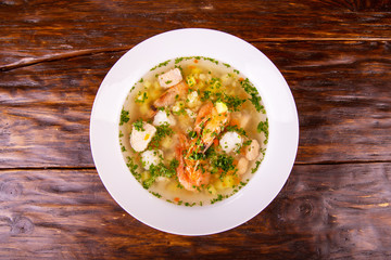 Fish and shrimps fresh greens and vegetables fish soup