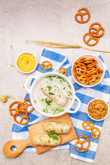 Oktoberfest set. White sausage weisswurst, pretzels, mustard, spikelets of grain, hop