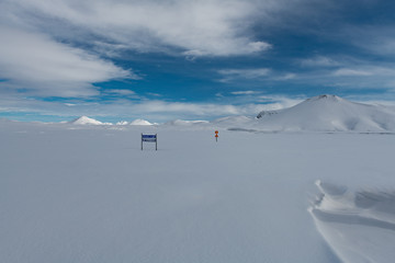 Iceland fully white plain in winter of Landmannalaugar area with lost road signs