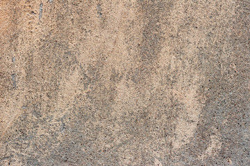 Texture of a concrete wall with cracks and scratches which can be used as a background