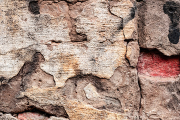 Texture of a concrete wall with cracks and scratches which can be used as a background