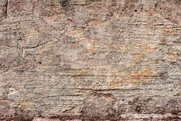 Texture of a concrete wall with cracks and scratches which can be used as a background