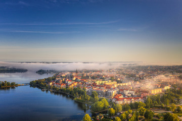 Foggy morning at the Elk Lake near Elk city. Masuria, Poland.