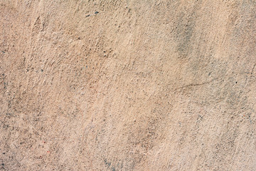 Texture of a concrete wall with cracks and scratches which can be used as a background