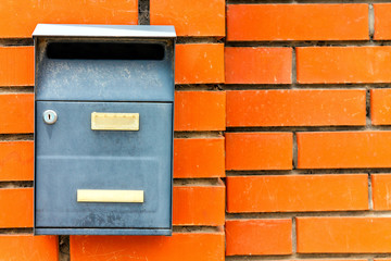 A beautiful mailbox hangs waiting for newspapers, parcels and letters.