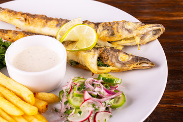 Fish with vegetables and potato fried