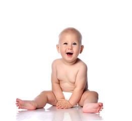 Infant child baby boy toddler sitting in diaper happy smiling laughing playing isolated on a white