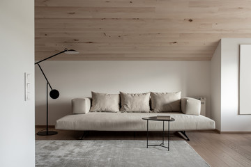 Light modern interior with sloping wooden ceiling - obrazy, fototapety, plakaty