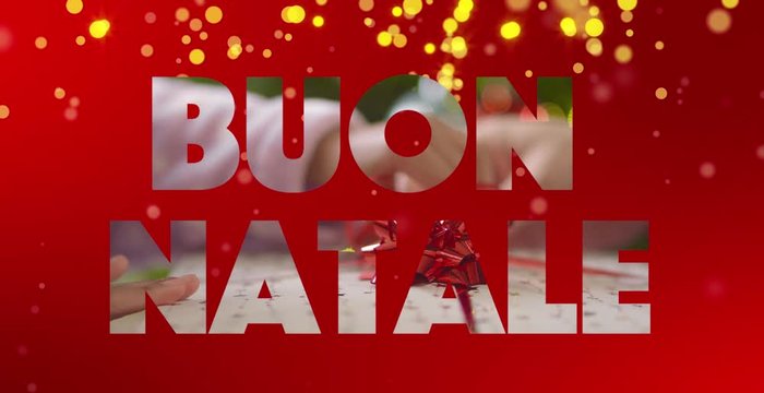 Il testo Buon Natale (in italiano) animato con scambio di regali al suo interno e stelle