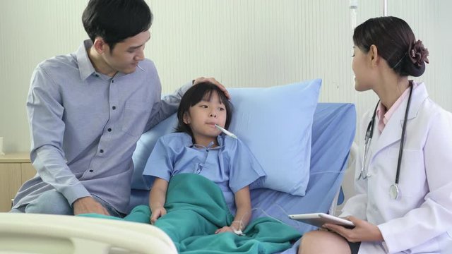 Asian doctor visit patient little girl and suggest physical examination at hospital. Concept of family, medical, healthcare and technology.